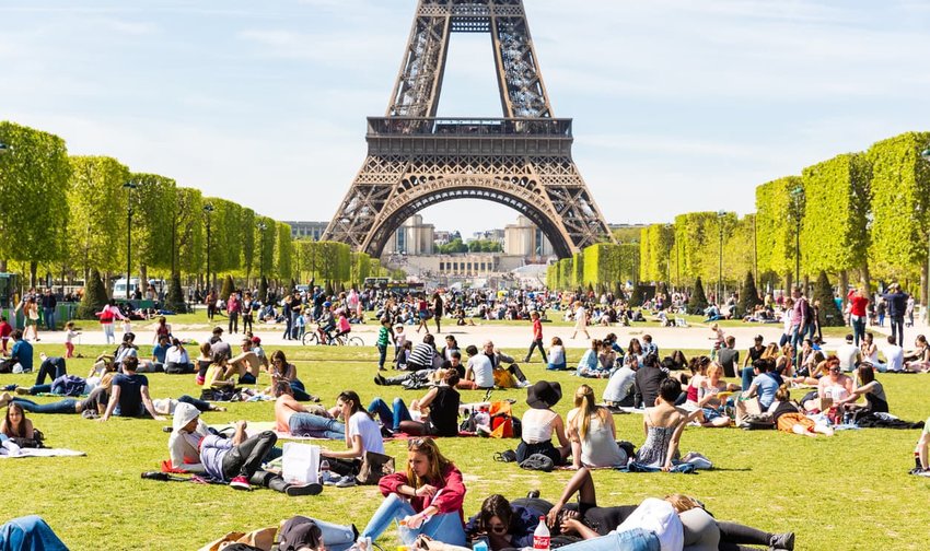 People on Champ de Mars with Eiffel Tower on background