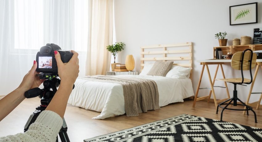 Photo being taken of a bedroom.