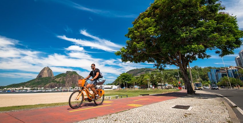 Man Cycling in Botafogo Beach, Rio de Janeiro