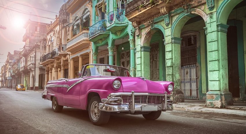 Vintage classic pink american convertible in old town of Havana Cuba