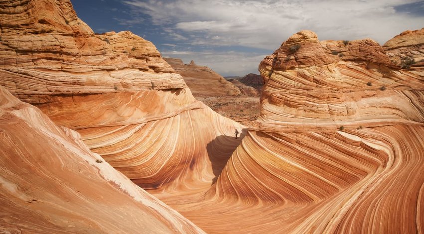 Lone hiker explores the Wave in American Southwest