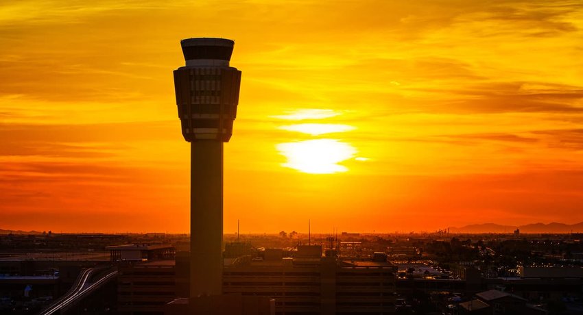 airport control tower at sunset