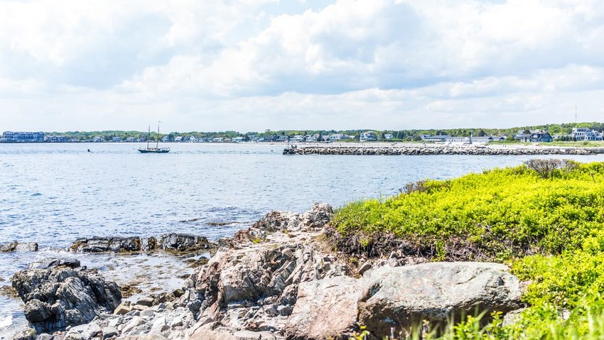 Cityscape or skyline of Kennebunkport town beach with ship and coast