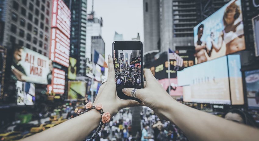 POV Woman Taking Picture With Mobile Phone at Times Squares, NYC