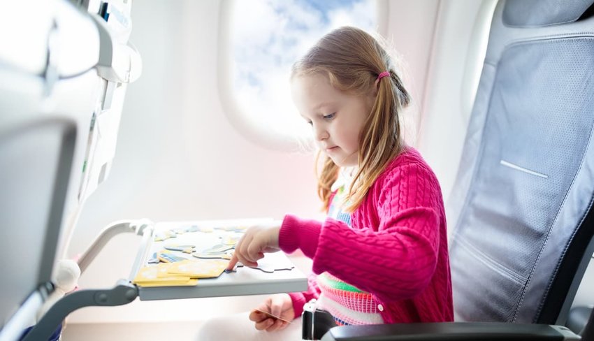 child playing on airplane