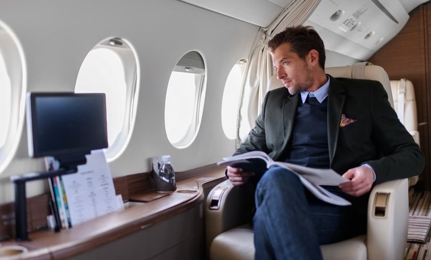 Man in private jet airplane