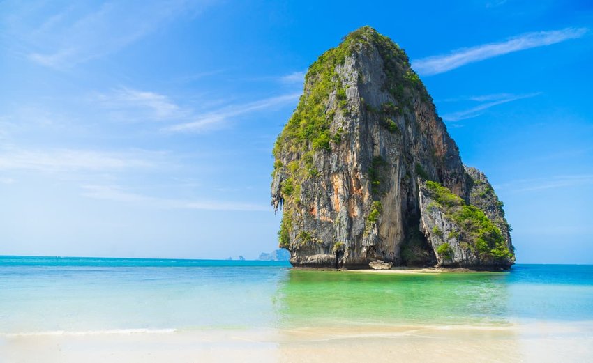 White sand, blue water beach with mountain at Phra Nang Cave beach in Krabi, Thailand