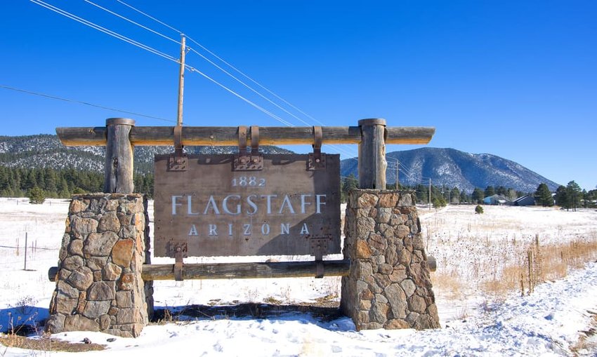 flagstaff sign with snow