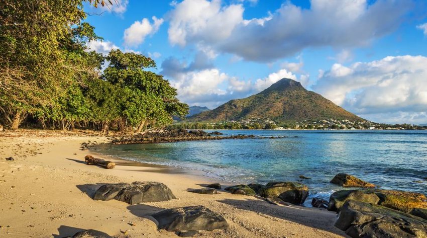 Rocky and sandy shore in Tamarin Bay, Wolmar, Flic en Flac, Mauritius Island, Indian Ocean