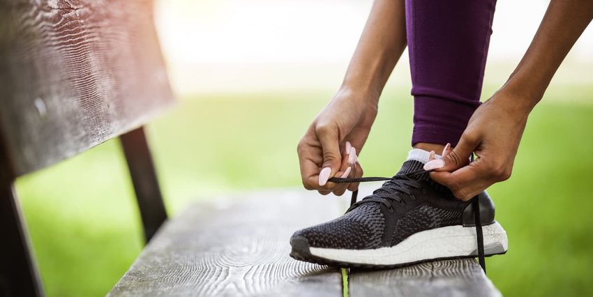 Woman Tying Shoes