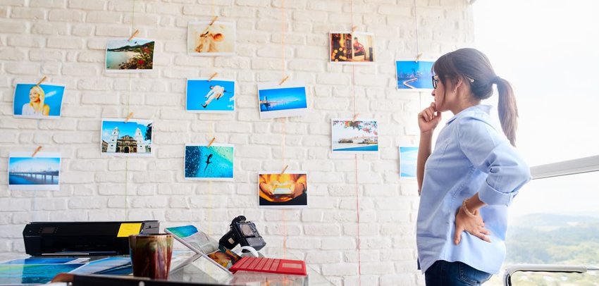 Woman Working As Photographer Checking Images In Studio