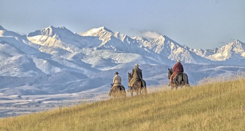 Cowboys riding the range, Montana horse ranch