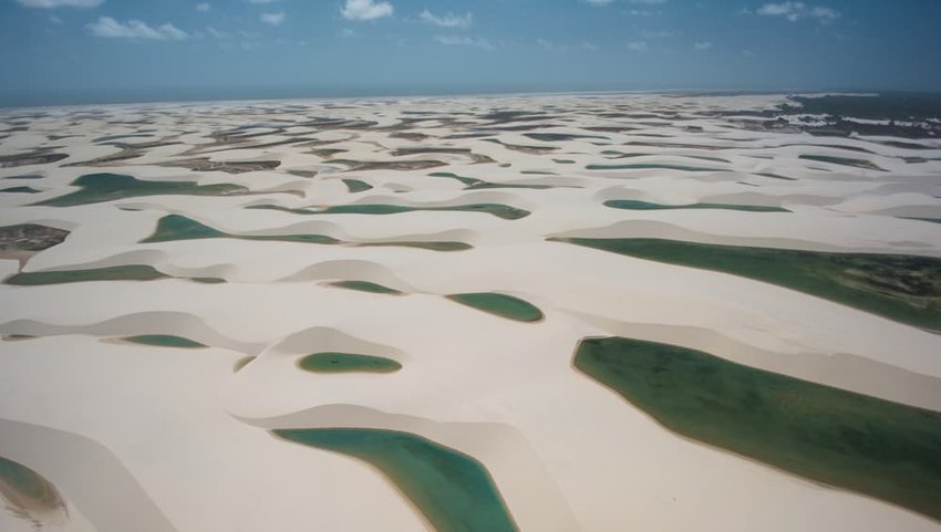 Natural rainwater pools in Lencois Maranhenses National Park seen from above, Maranhao, Brazil