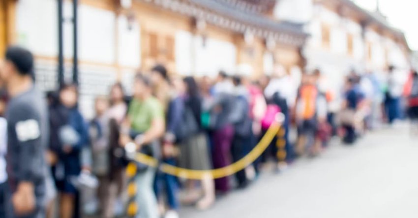 blurred people queuing at the theme park : for background use