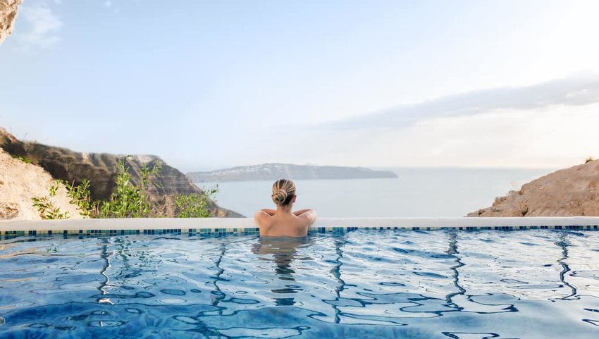 Woman-relaxing-in-a-pool-with-a-view