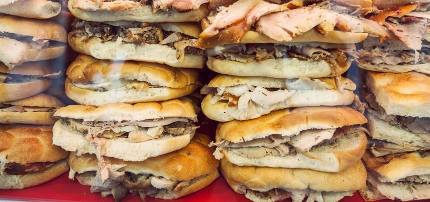 Stacked Porchetta Sandwiches in Italy