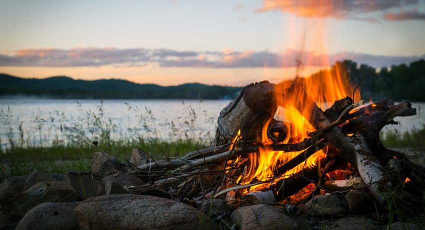 Summer Campfire and Lake at sunset