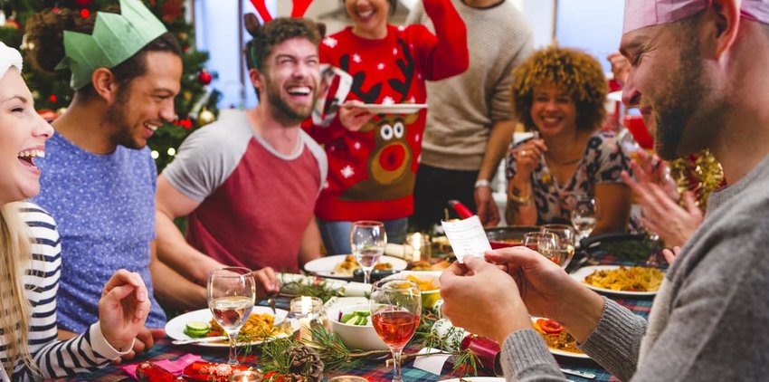 Friends opening Christmas Crackers