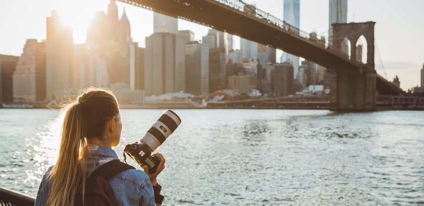 Young woman taking pictures of New York City