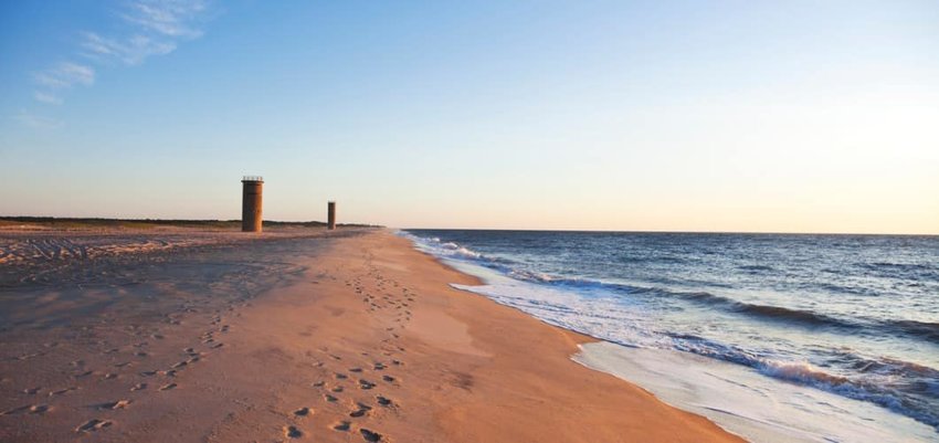 Lookout tower on the beach next to the sea