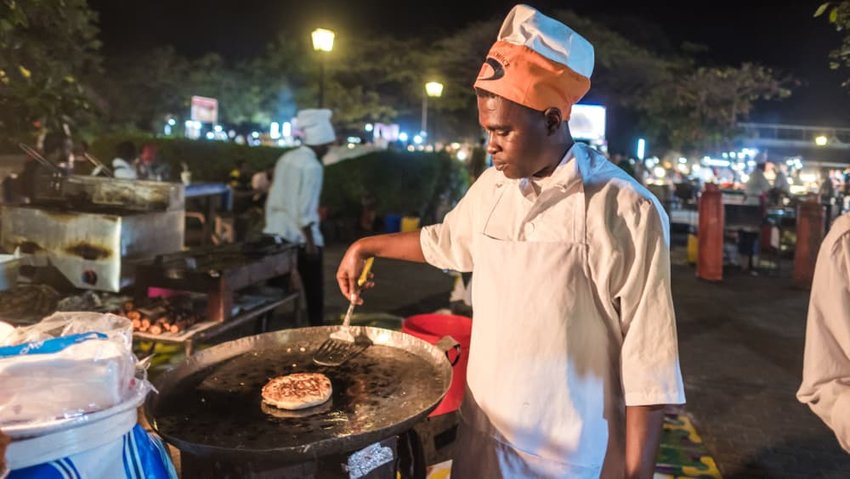 African chefs cooking Zanzibari pizza at Forodhani Gardens