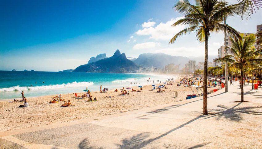 Palms and Two Brothers Mountain on Ipanema beach in Rio de Janeiro, Brazil.