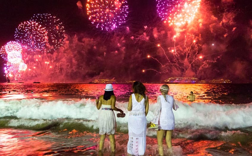 women-standing-in-waves-in-brazil