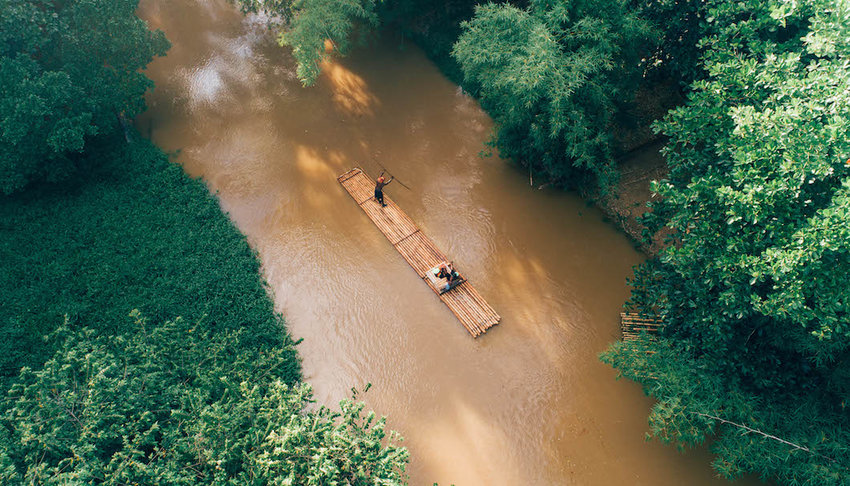 Bamboo-raft-floating-down-a-river