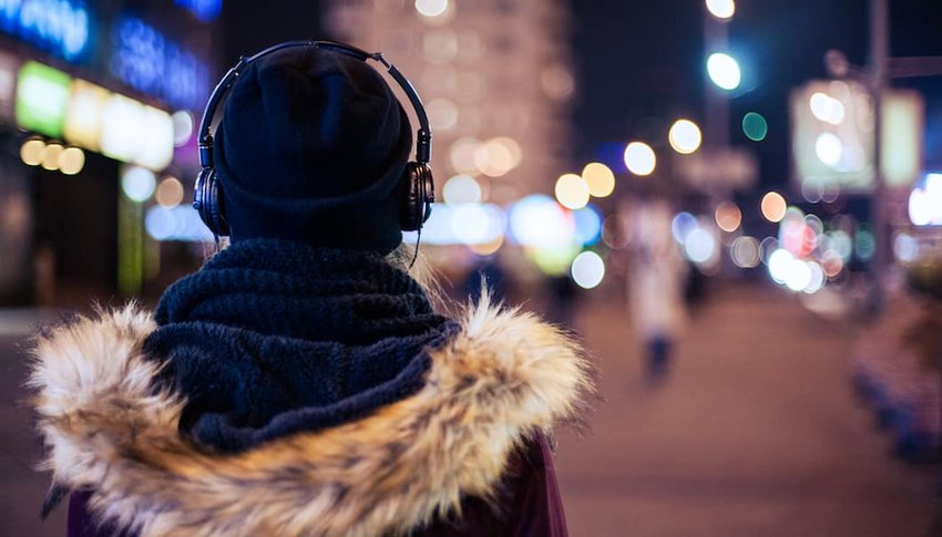 Girl-walking-through-night-city-street