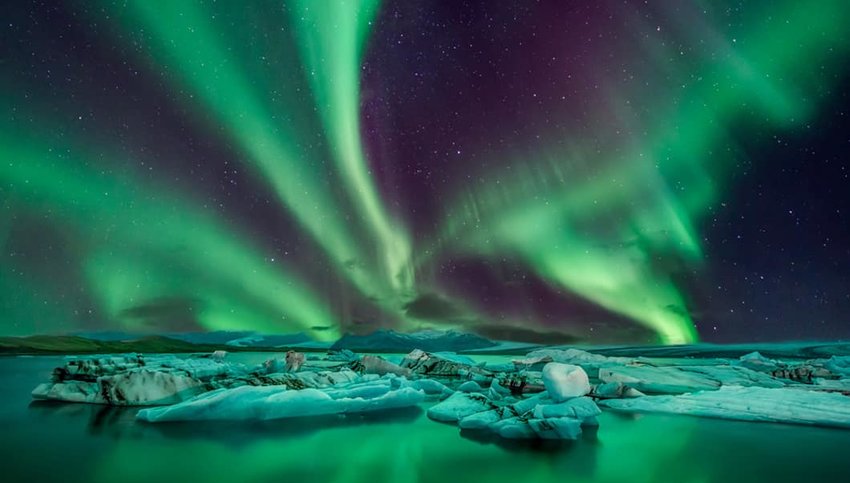 Photo of northern lights over Reykjavik, Iceland