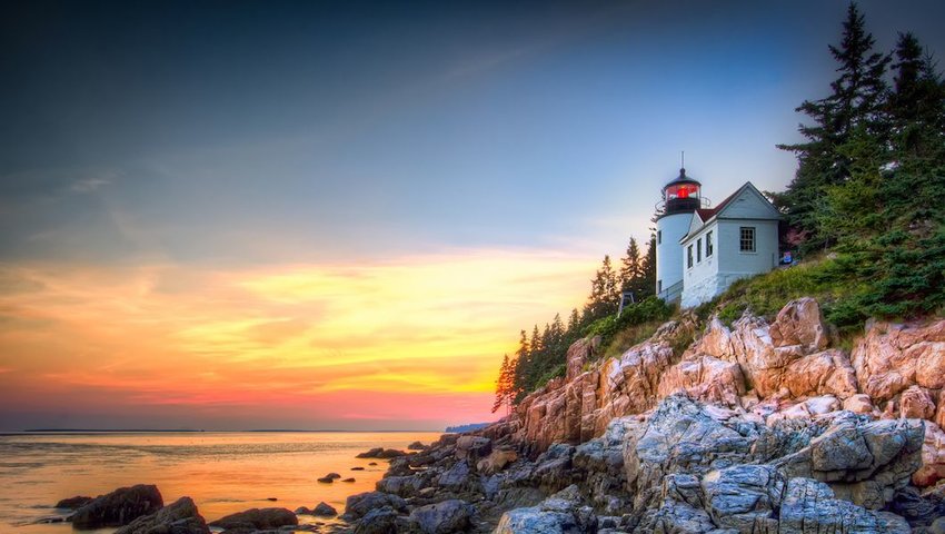 Photo of a lighthouse and rocky shoreline in Acadia National Park