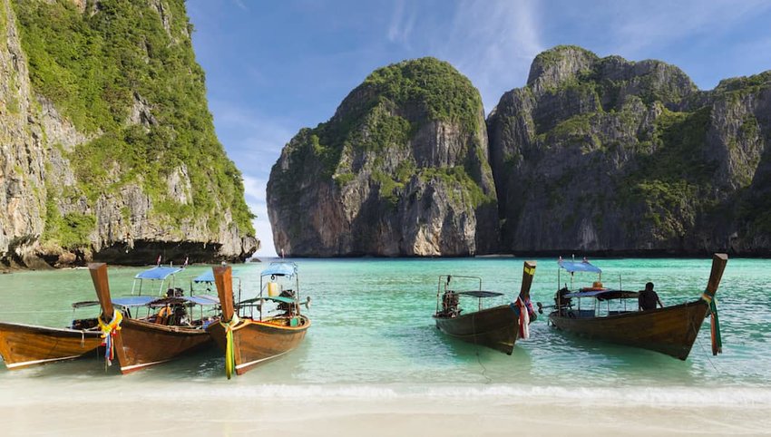 Photo of anchored boats in Maya Bay