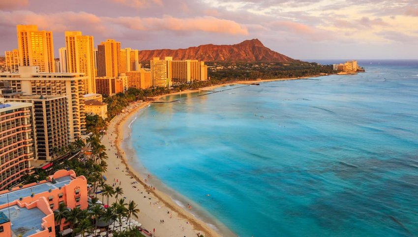 Honolulu skyline and coast at sunset.