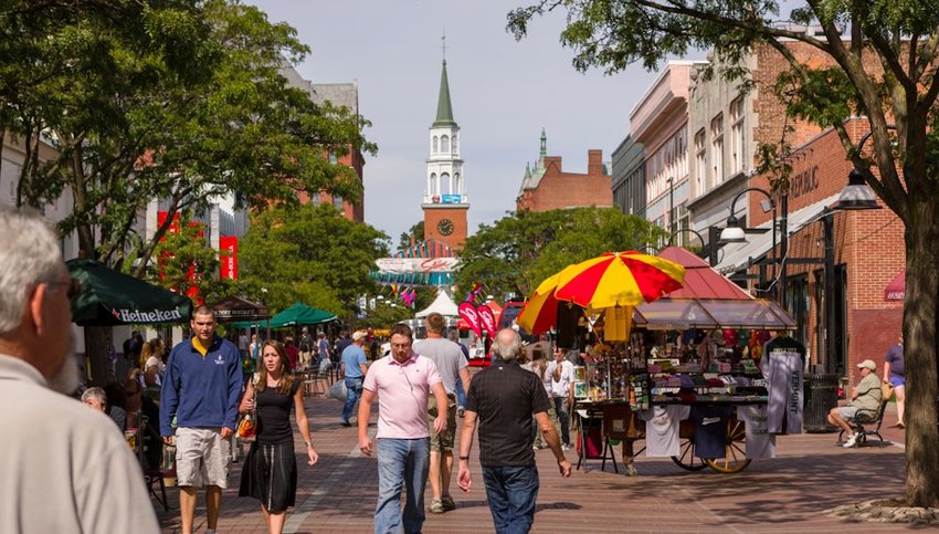  People on Church Street, a pedestrian mall with sidewalk cafes and restaurants.