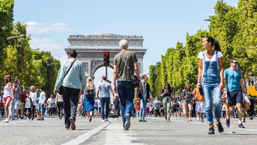 People walking on the famous French boulevard Champs Elysees