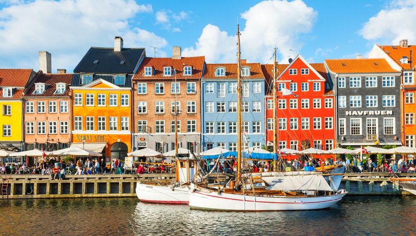Nyhavn pier with colorful buildings and boats in Copenhagen