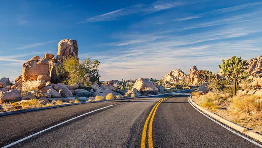 Photo of a road running through a desert