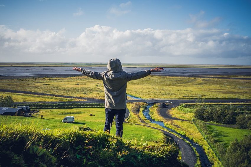 Person alone on the Seljalandsfoss mountainside