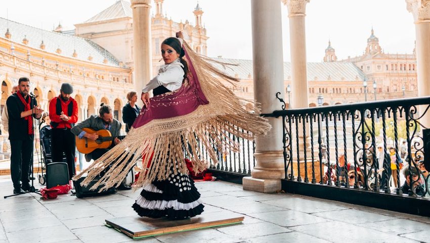 Woman dancing with the traditional flamenco dress. 