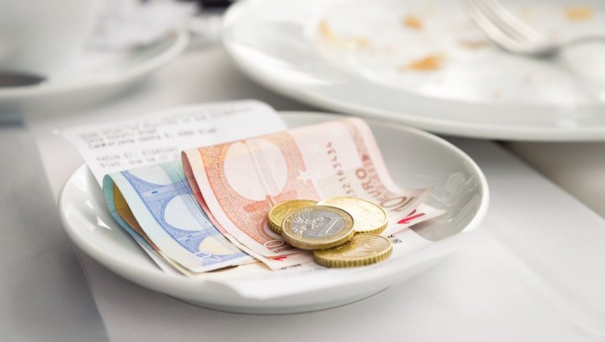 Plate with Euros at a restaurant