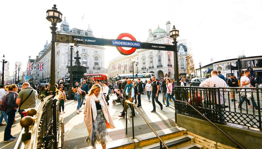 People entering the underground entrance in London