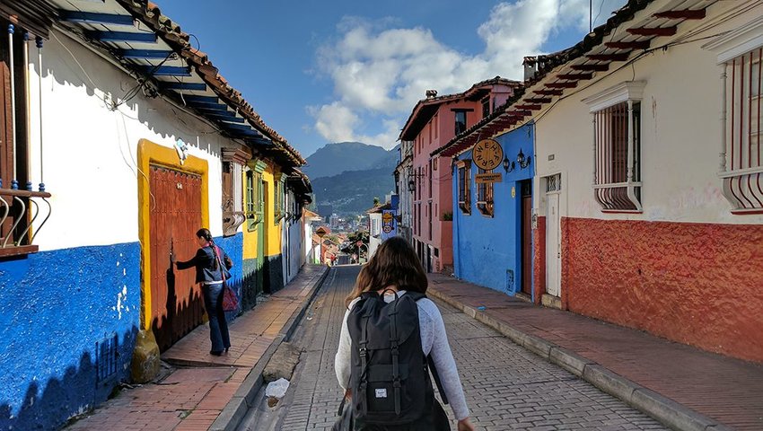 Woman walking in the La Candelaria neighborhood of Bogotá, Colombia