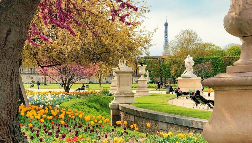 People relaxing in a European park during Spring time.