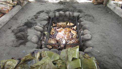 Outdoor Underground Oven in South Pacific Island with Pig Roast.