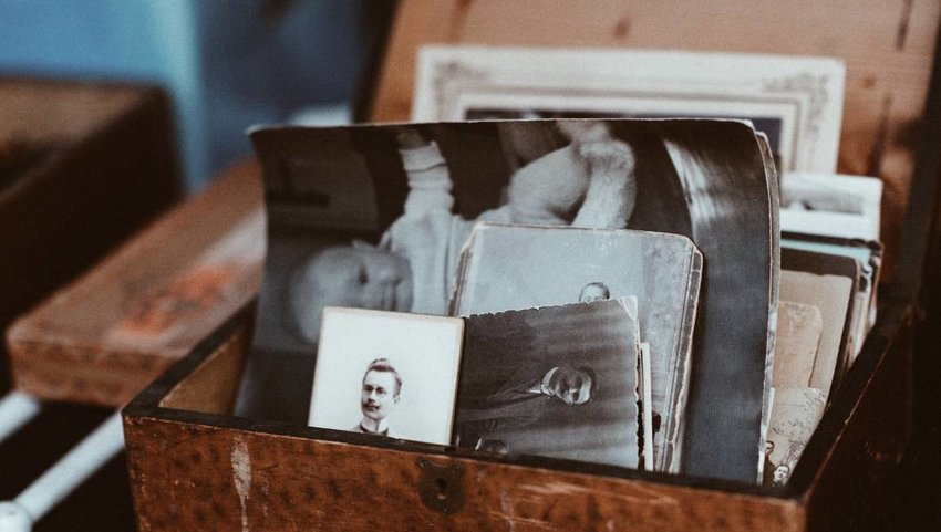 Old photo trunk with black and white photos.