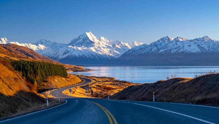 Scenic winding road along Lake Pukaki to Mount Cook National Park