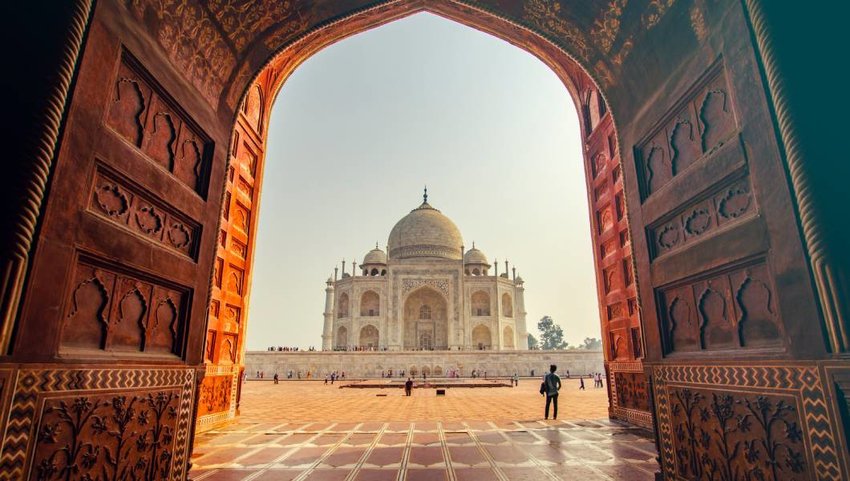 The Taj Mahal viewed through an archway.