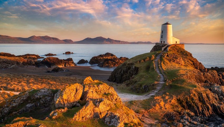 Sunset behind lighthouse on Llanddwyn Island