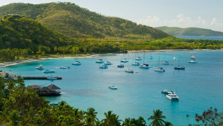 Aerial view of blue waters and anchored ships, Britannia Bay, Mustique