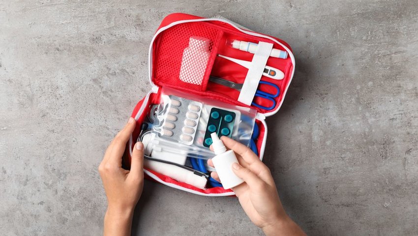 woman packing first aid kit